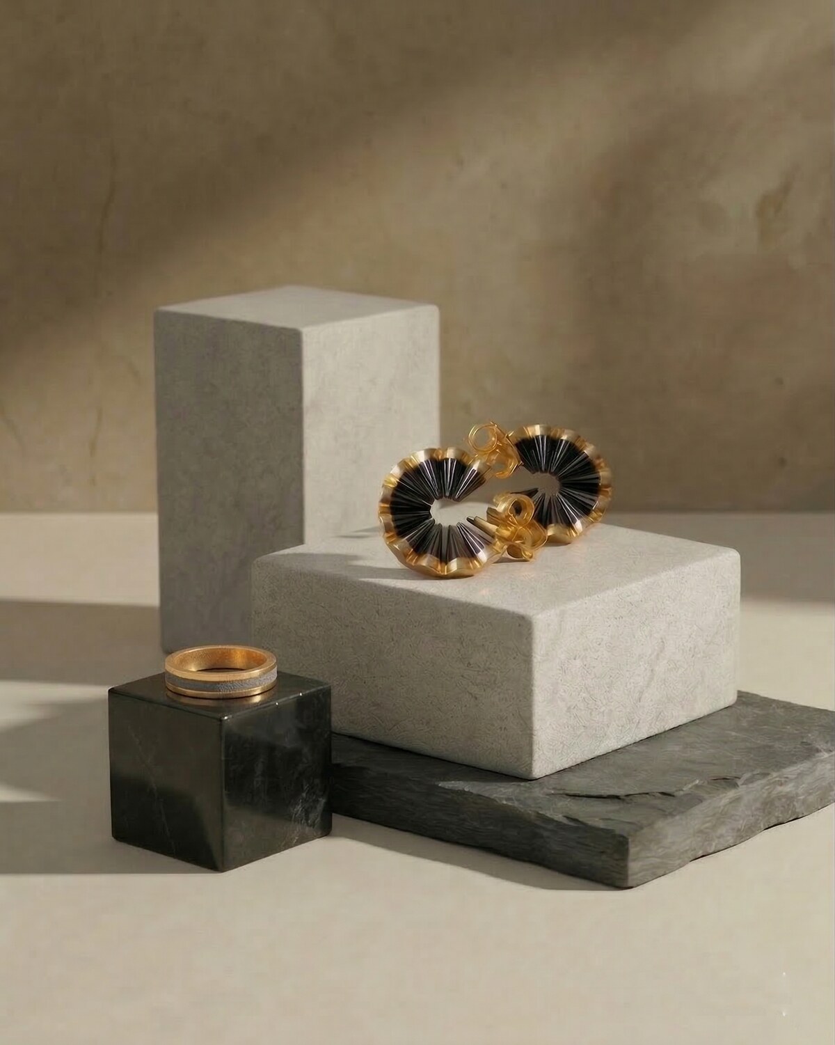 illi Collection Line Ring and Vertigo Earrings on minimalist stone pedestals